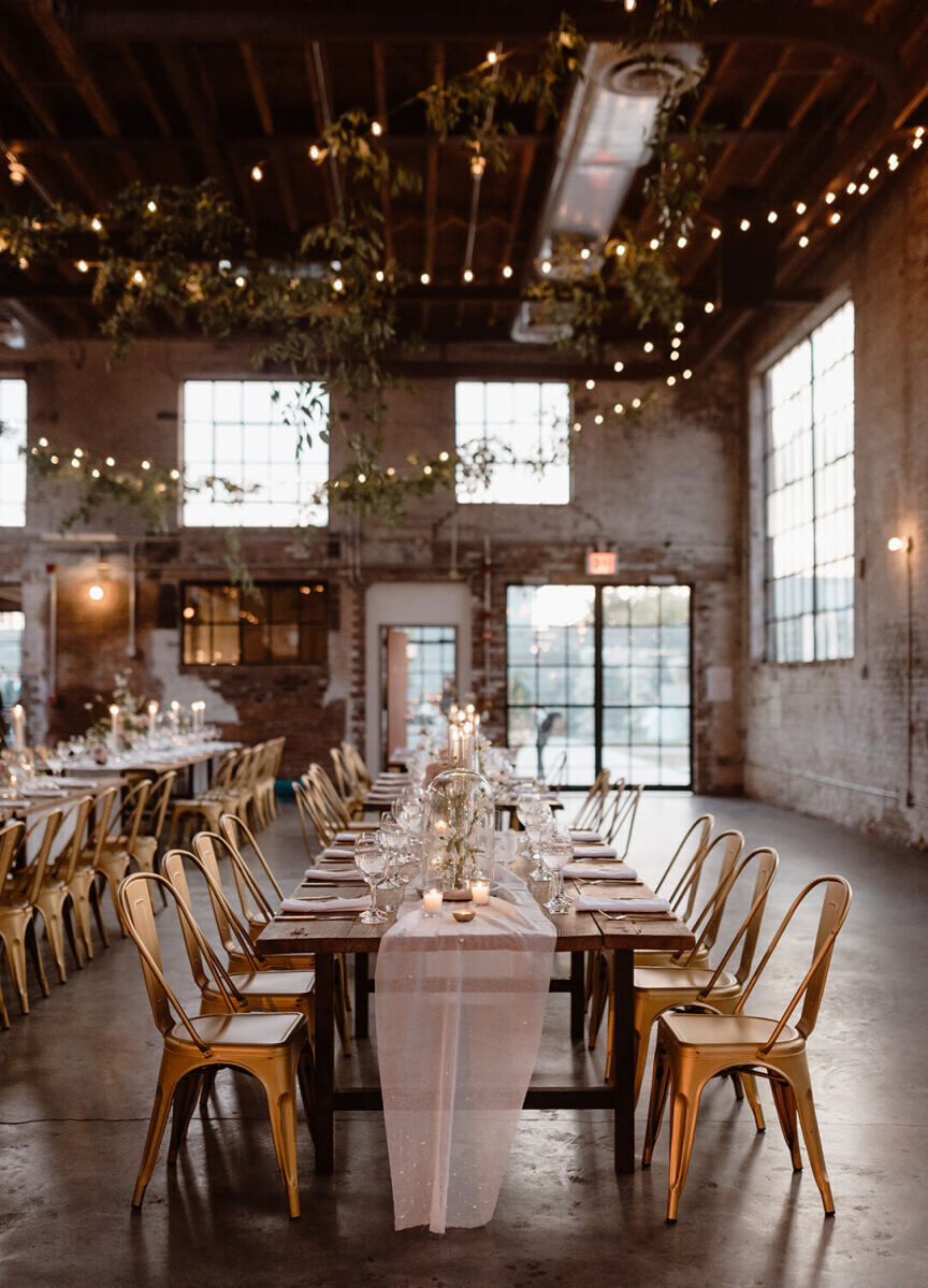 Industrial Wedding Venues: A wedding reception table under twinkle lights at 99 Scott.
