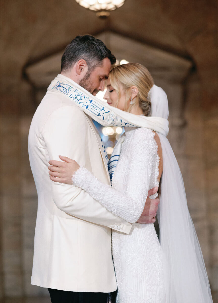 Kate Bock Kevin Love Wedding: Kate Bock and Kevin Love embracing with their foreheads touching during an intimate moment in their wedding ceremony.