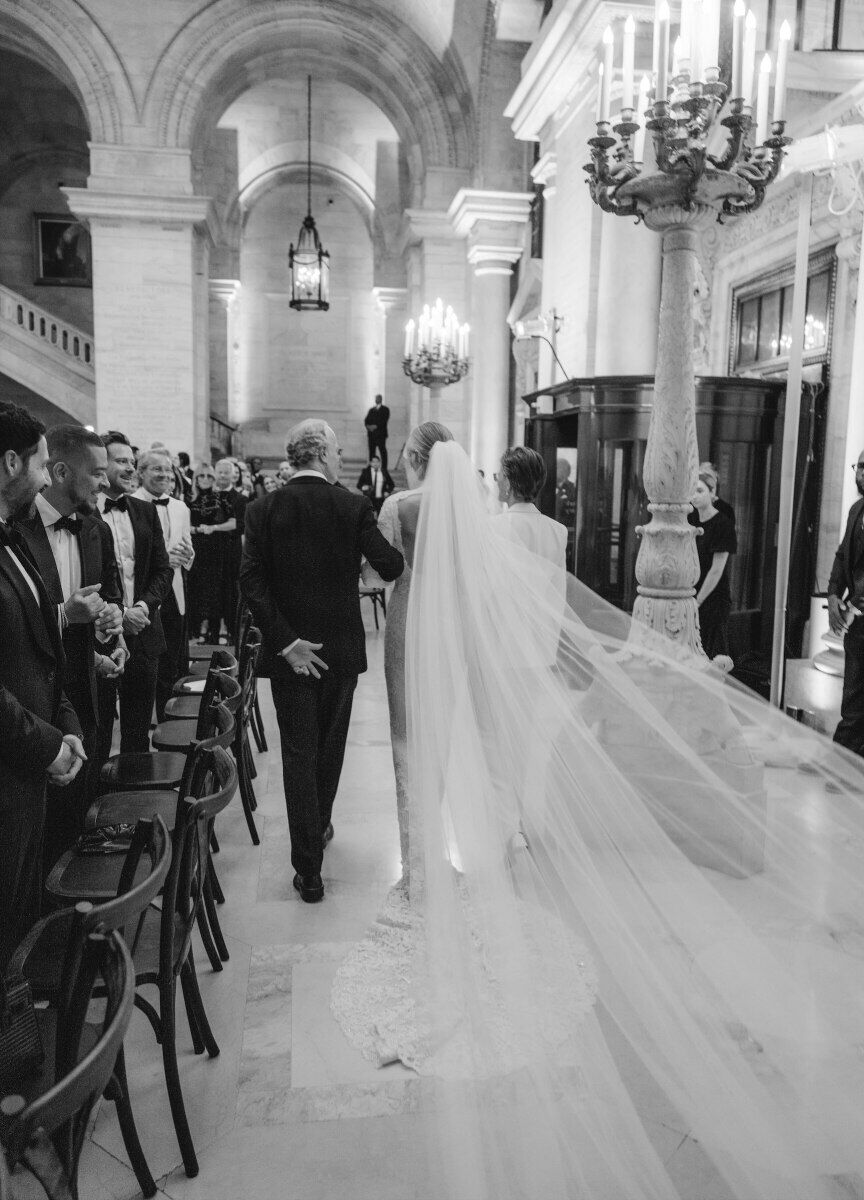 Kate Bock Kevin Love Wedding: Kate Bock walking down the aisle with her parents at her wedding ceremony.