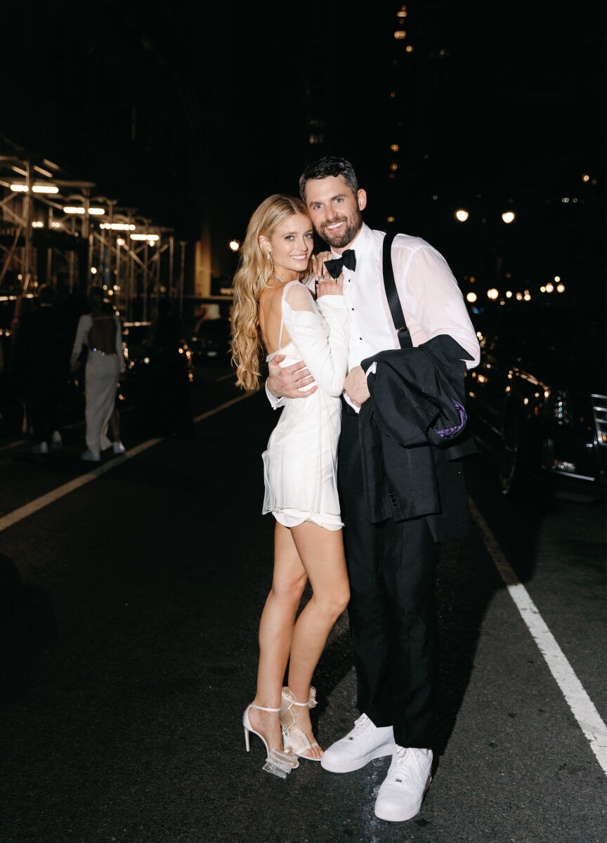 Kate Bock Kevin Love Wedding: Kevin Love and Kate Bock posing toward the end of the night at their wedding.