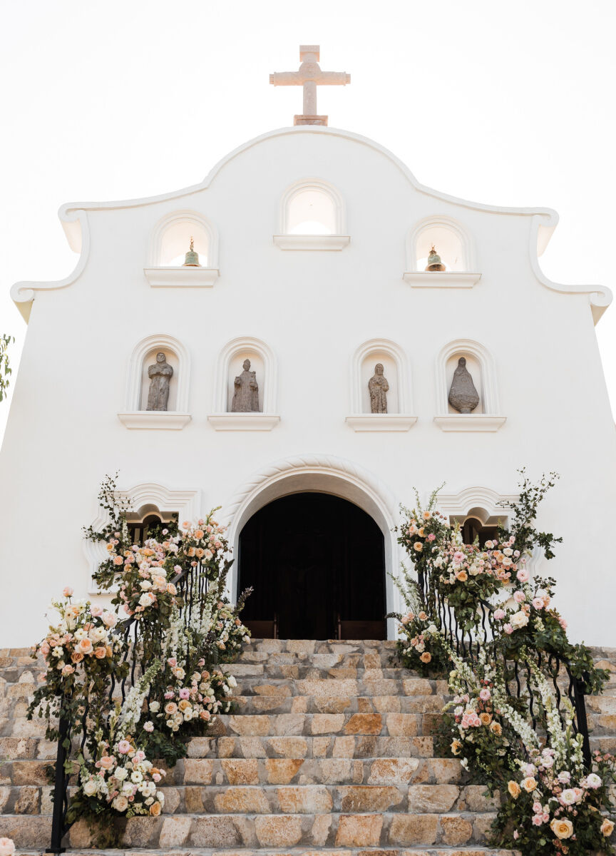 Mexican wedding: floral lined stairway into a Mexican historic wedding chapel
