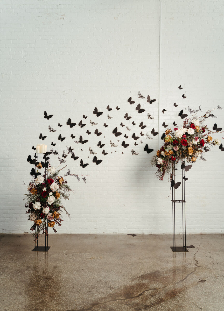 Best Places for a Minimalist Wedding: A ceremony setup with black butterflies on the wall at The Madison.