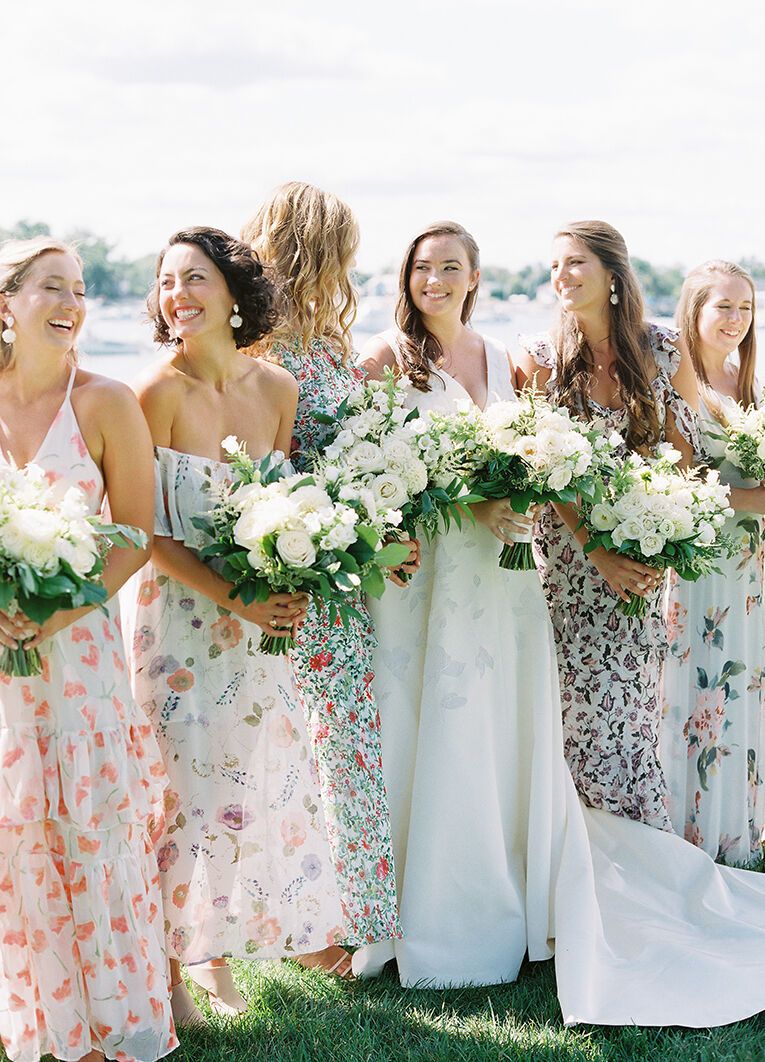Mismatched bridesmaid dresses: See more assorted patterned unique bridesmaid dresses from Liz and James' waterfront wedding