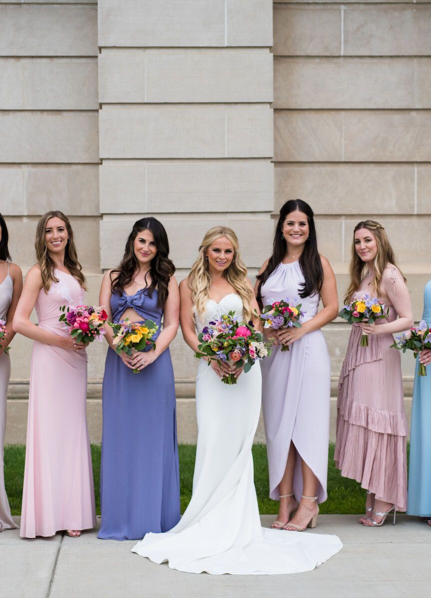 Mismatched bridesmaid dresses: See more assorted pink and purple unique bridesmaid dresses from Lily and Ben's classic wedding