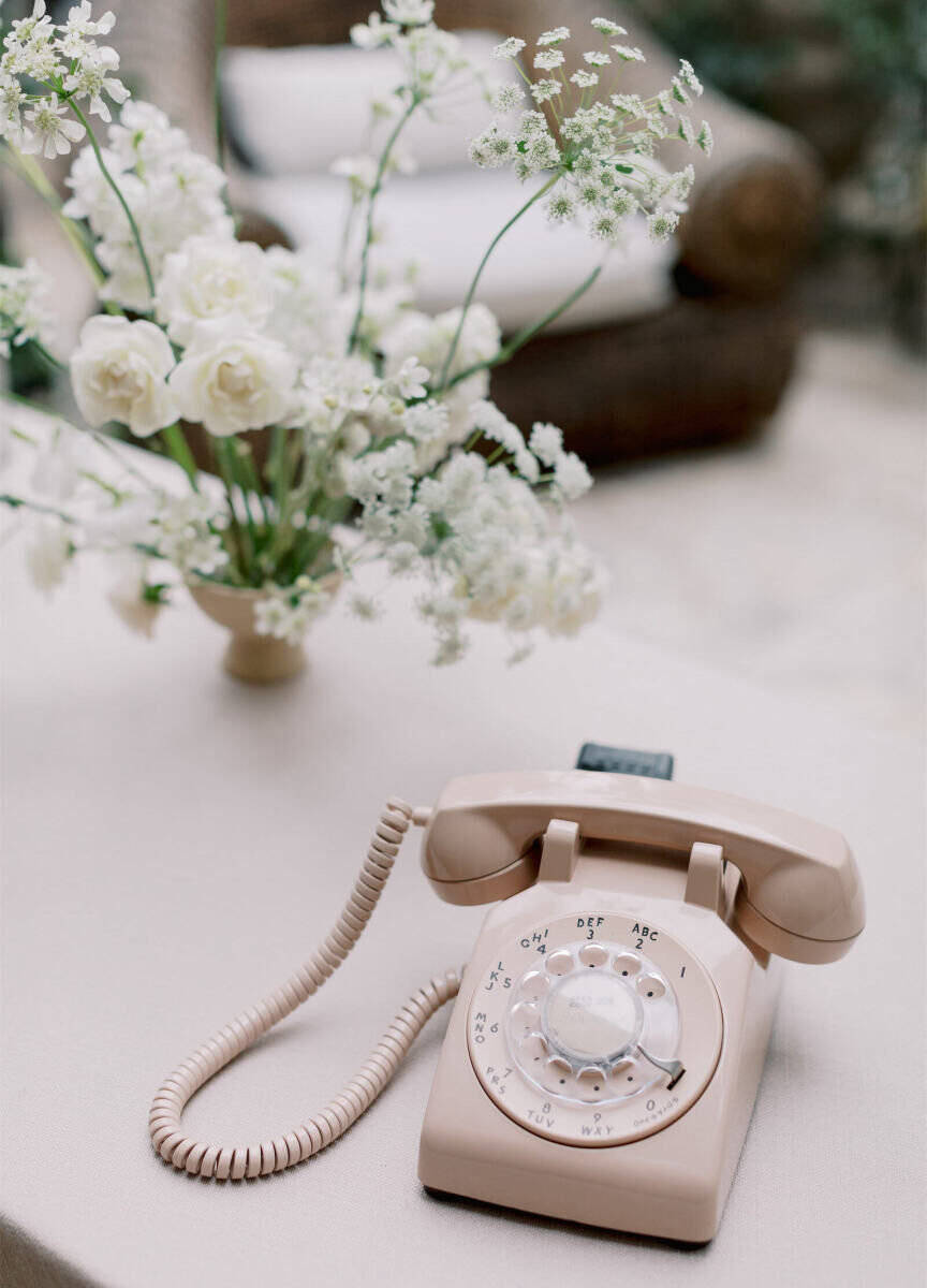 A rotary phone served as a twist on the traditional guest book, as guests could leave voice memos for the couple during their modern California wedding reception.