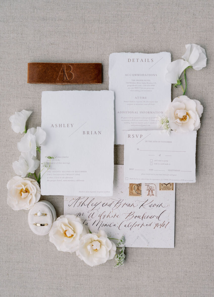A letterpress invitation with brown ink, a monogrammed leather band, and calligraphed outer envelopes perfectly fit the mood of this modern California wedding.