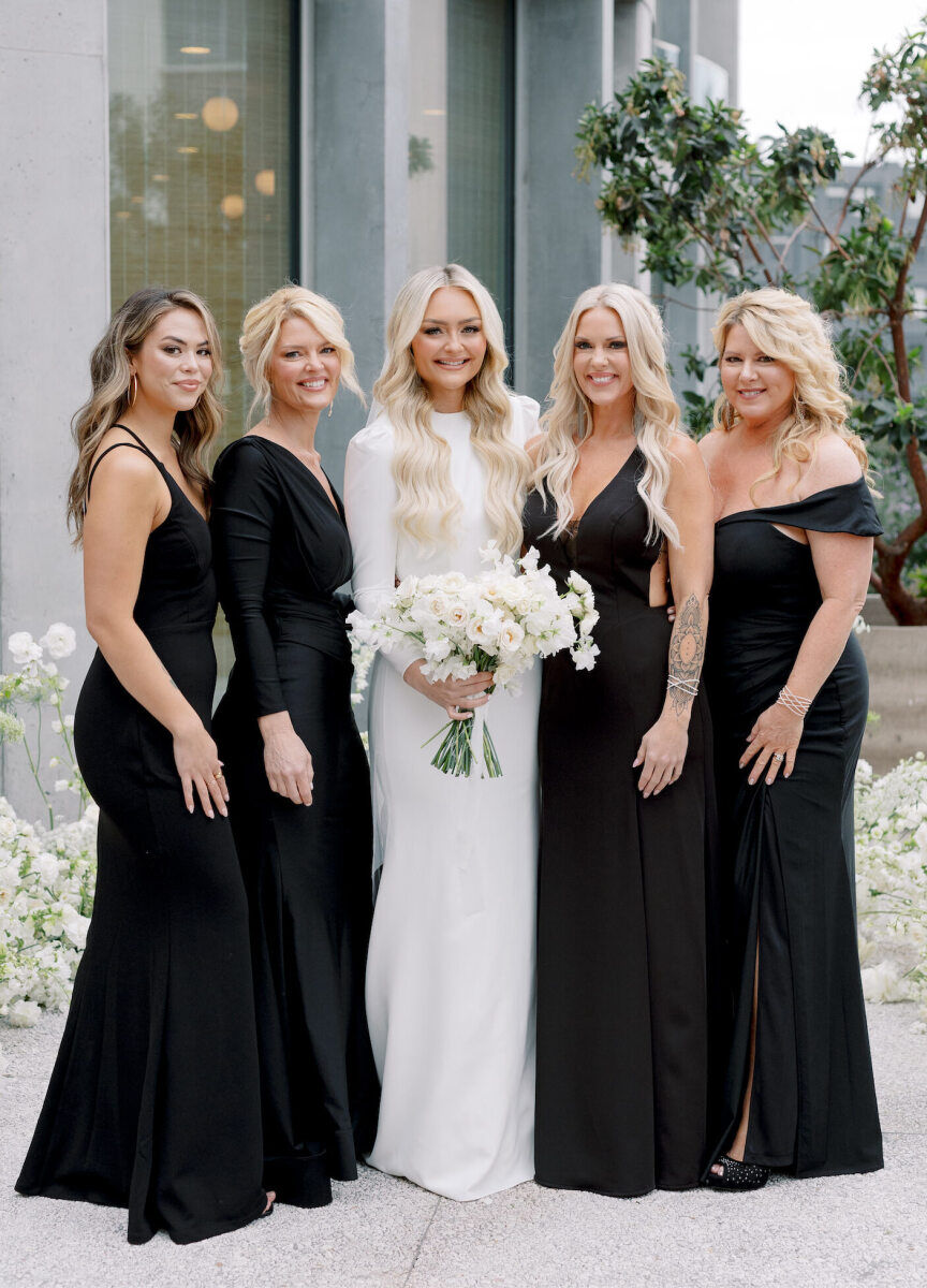 A bride and her four bridesmaids—who wore long black gowns—at her modern California wedding.