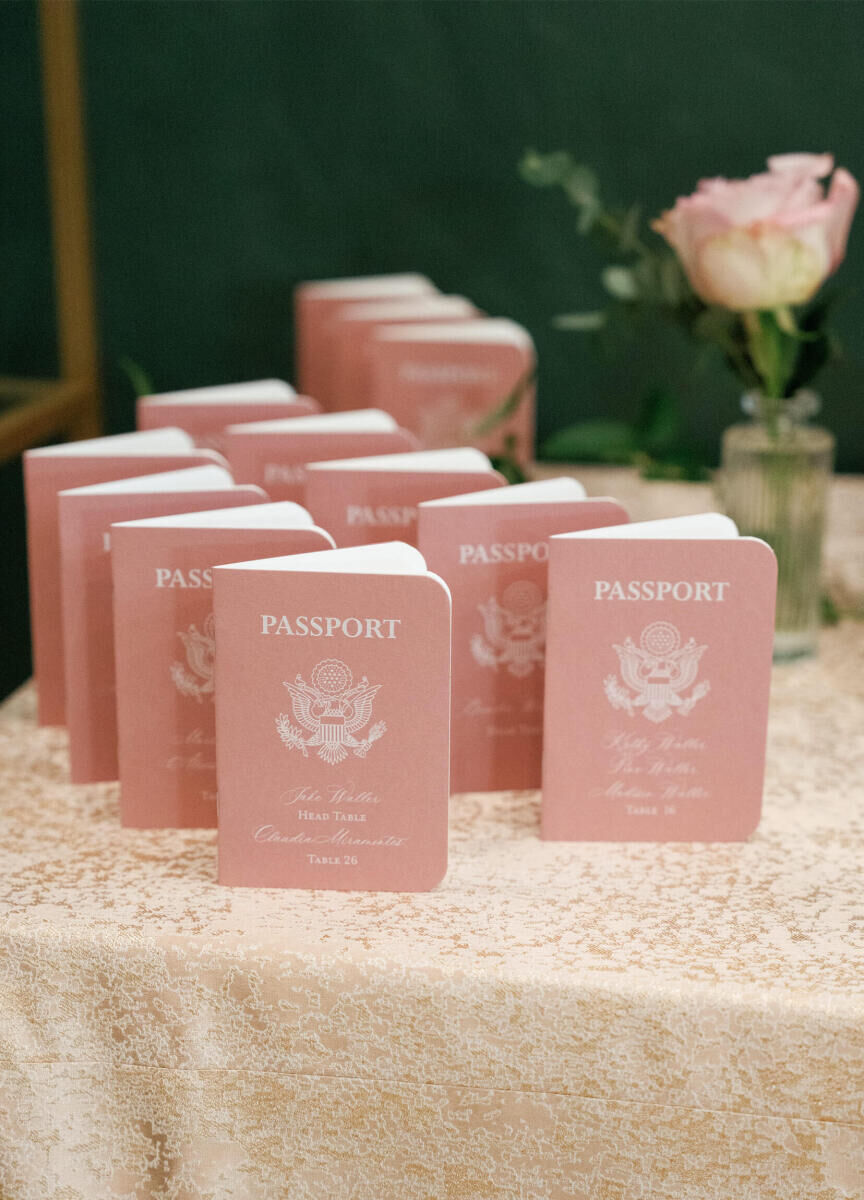 Instead of traditional escort cards, guests found their seats thanks to pink passports at this modern fairytale wedding.