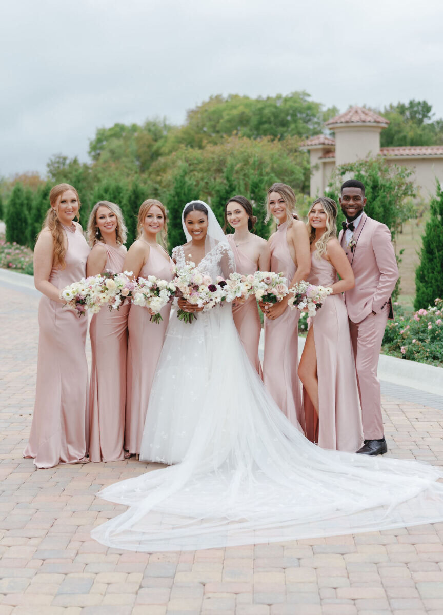 The ladies and gentleman in this bride's wedding party wore blush pink, in honor of her favorite color, which was used throughout her modern fairytale wedding.