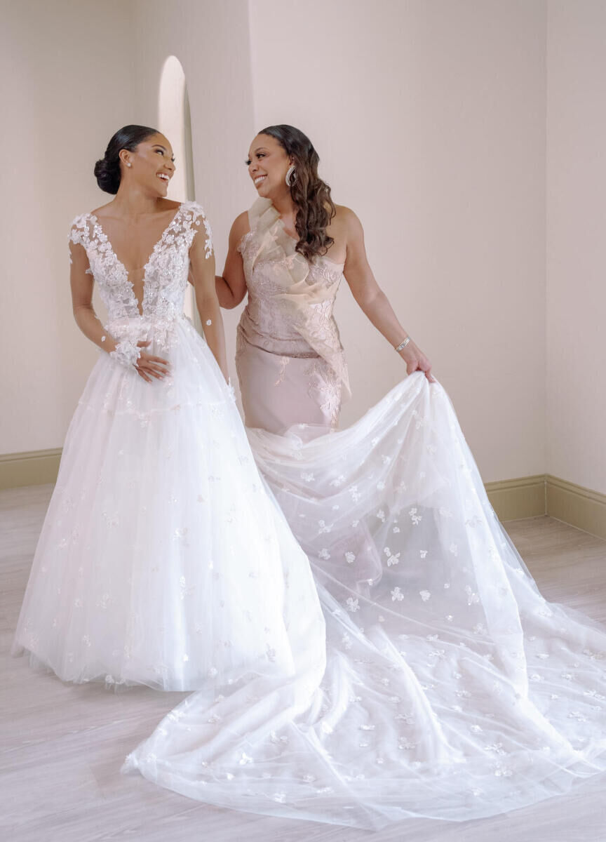 A bride and her mother take portraits while getting ready for her modern fairytale wedding.