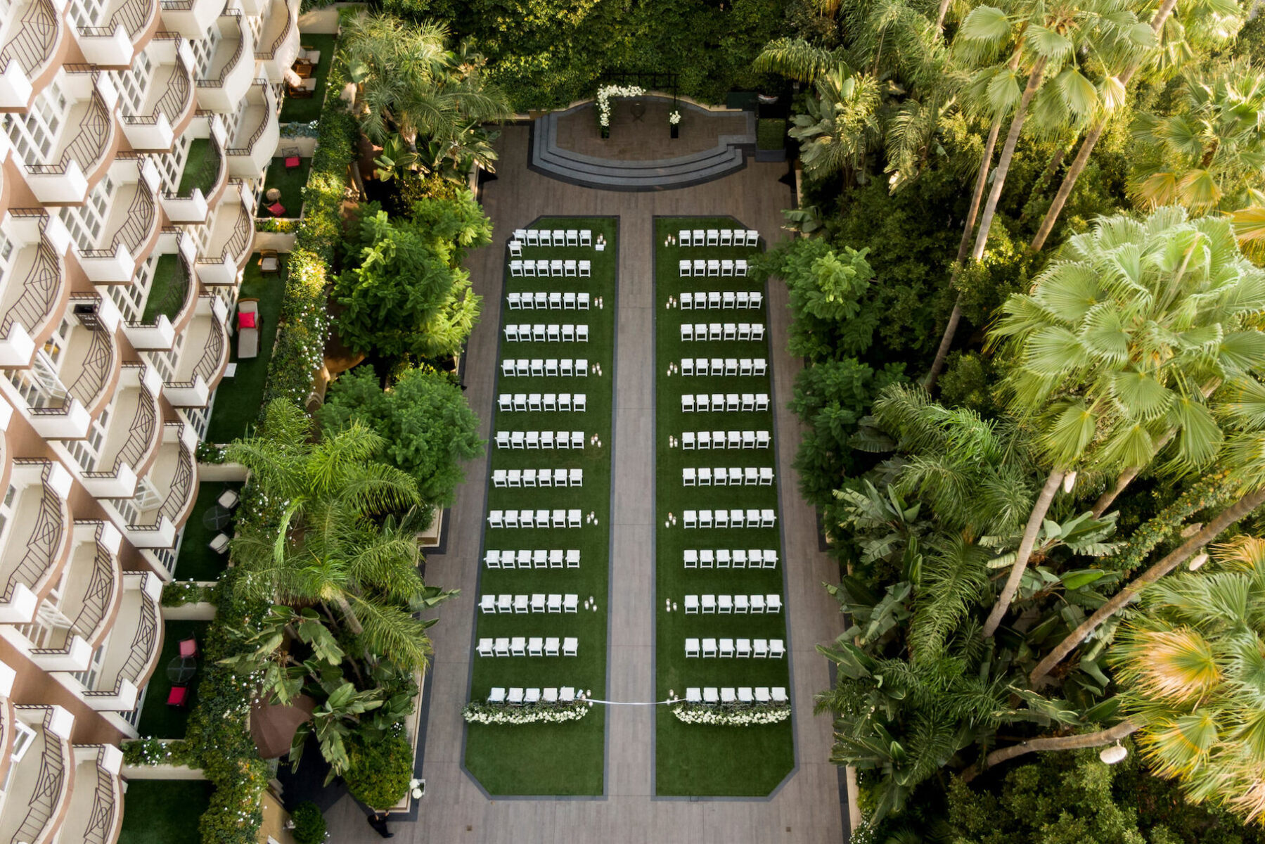 An aerial shot of a modern wedding ceremony set in the garden of the Four Seasons Hotel Los Angeles at Beverly Hills.