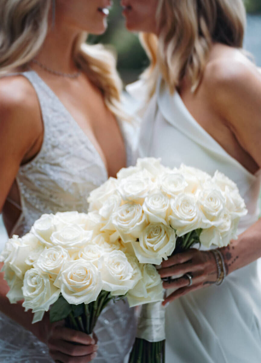 These brides went for a modern wedding look when it came to their flowers, which were white and mono-varietal, like their all-rose bouquets.