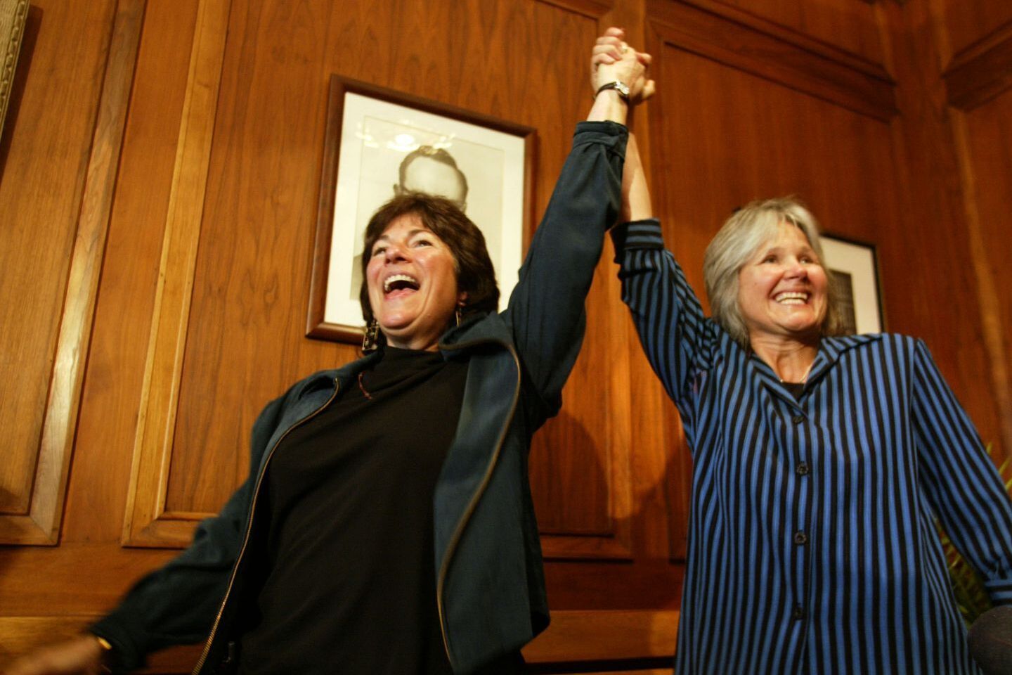 Most Influential Women in History Weddings: Tanya McCloskey and Marcia Kadish holding their clasped hands in the air just moments after saying I-DO
