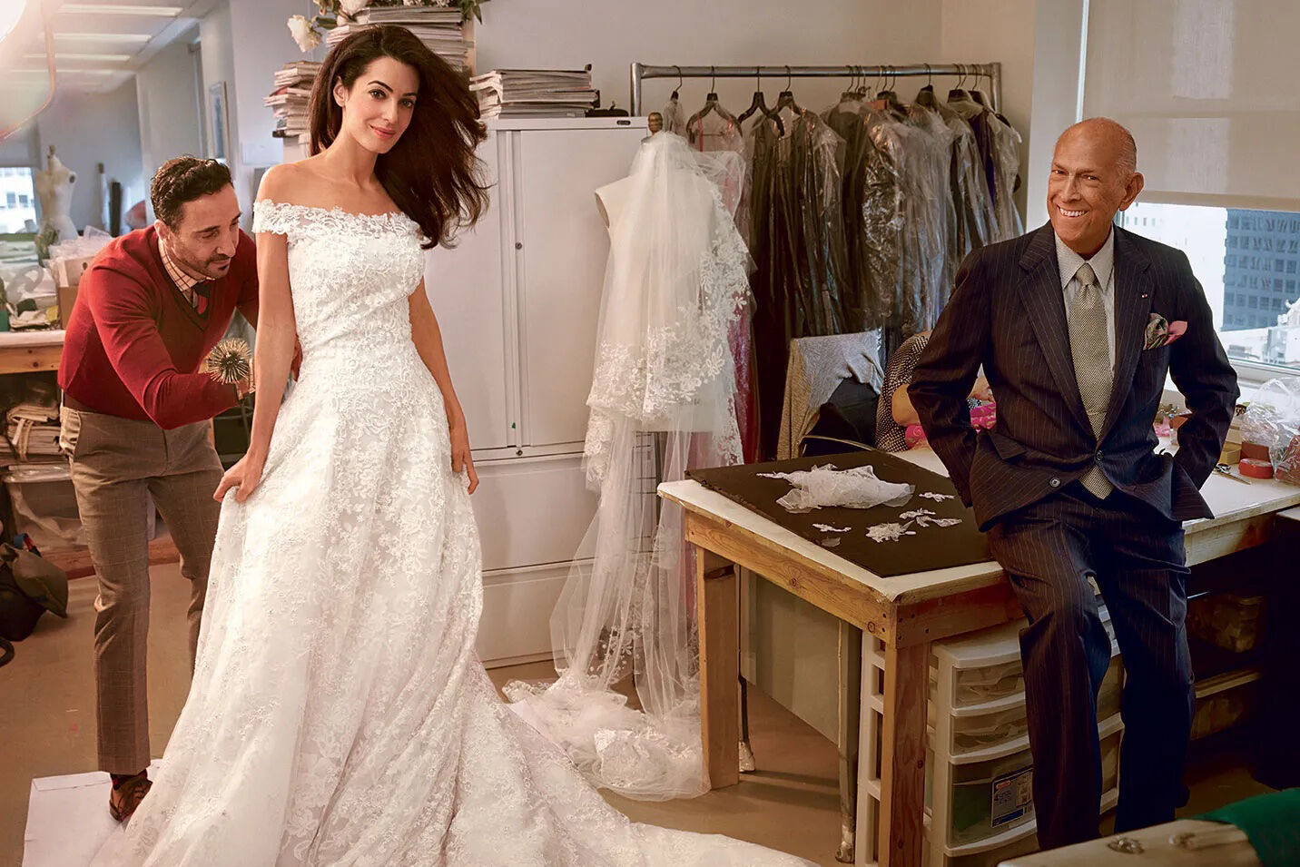Most Influential Women in History Weddings: Amal Clooney at her wedding dress fitting with Oscar de la Renta