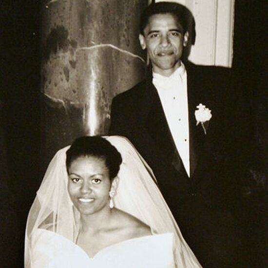 Most Influential Women in History Weddings: Michell Obama in wedding dress and veil posing with husband Barack Obama