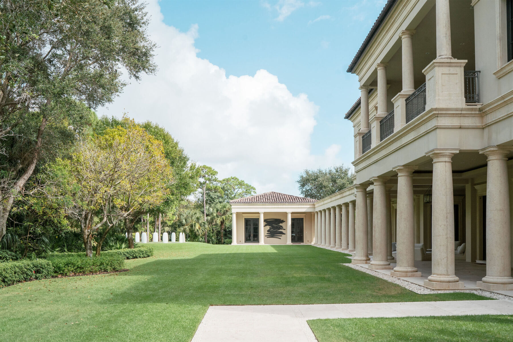 A facade and lawn of the Norton Museum of Art in Palm Beach, Florida.