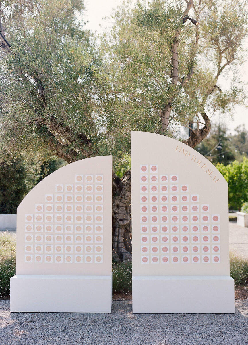 A modern, rounded escort card display.