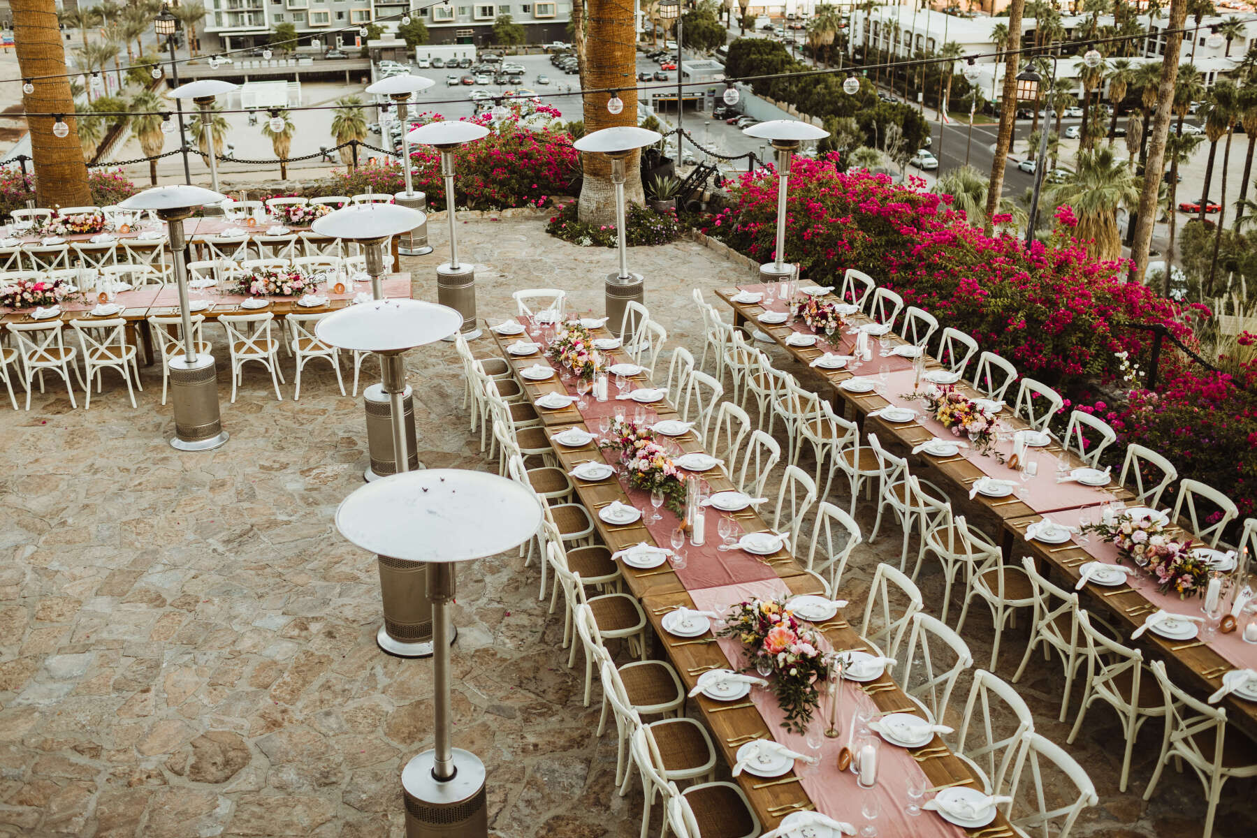 Pink Wedding: Four long rectangular tables at an outdoor reception setup in Palm Springs.