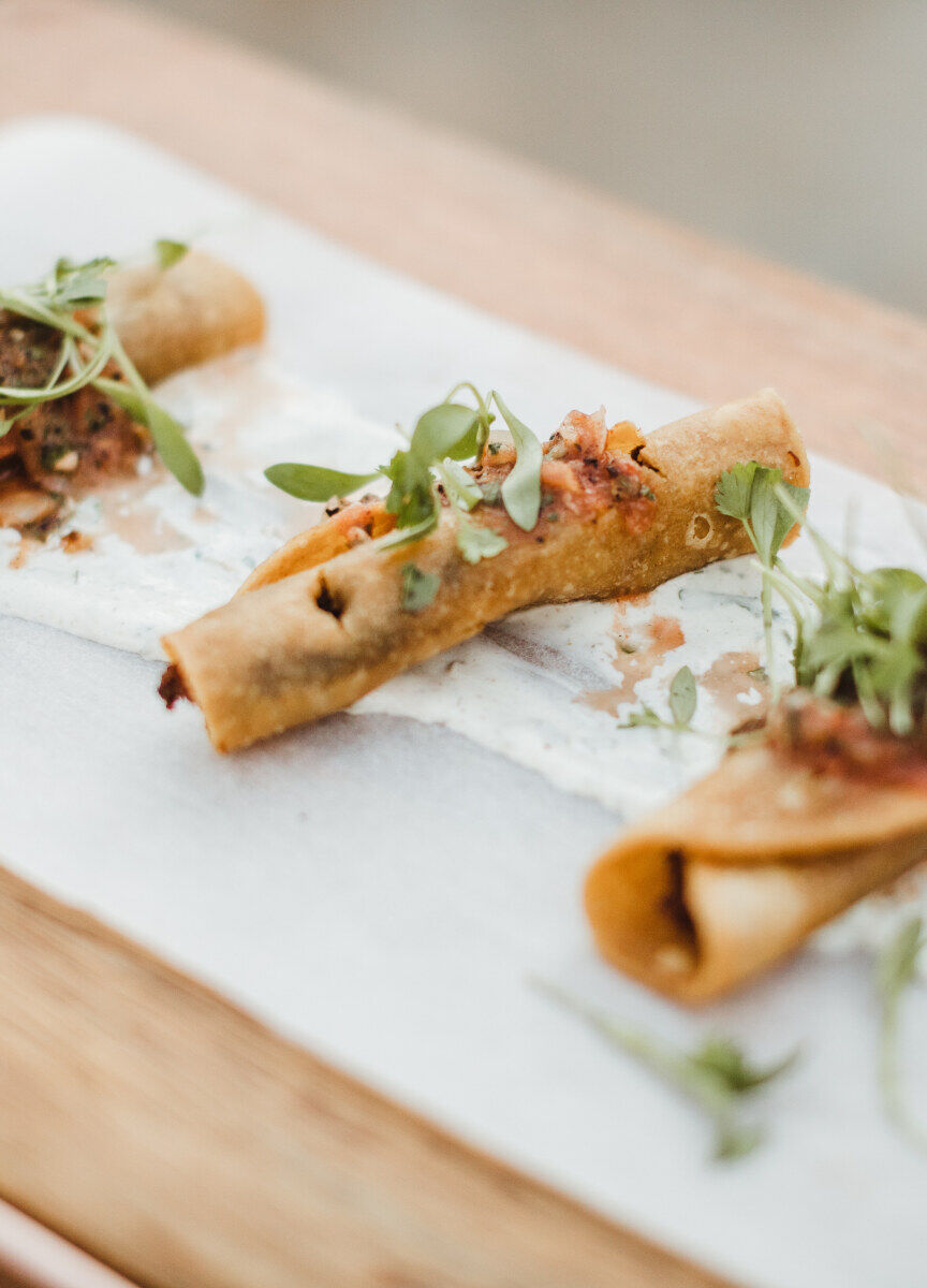 Pink Wedding: Taquitos on a platter at a wedding in California.