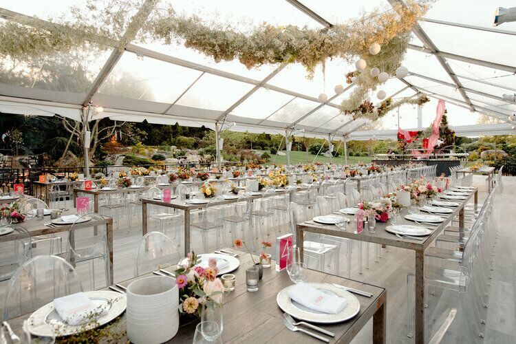 Tented Wedding Ideas: Inside of a tented wedding reception, opaque-top tent with baby's breathe foral installation