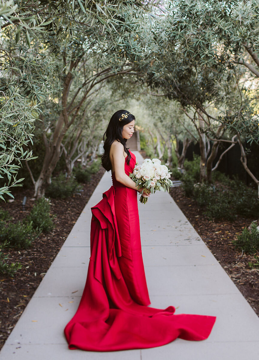 Bride wearing red wedding dress 