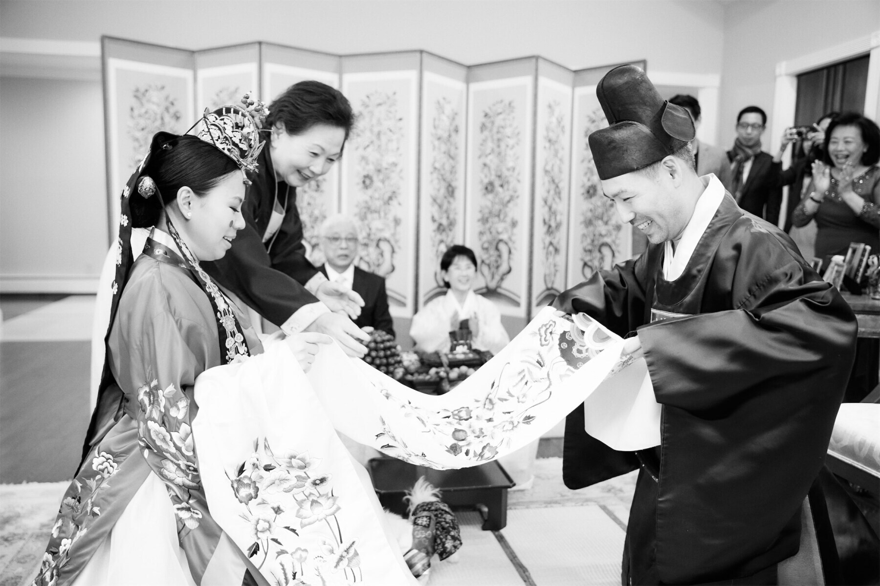 A couple during their Pyebaek ceremony at the groom's parents' home before celebrating at their restaurant wedding.