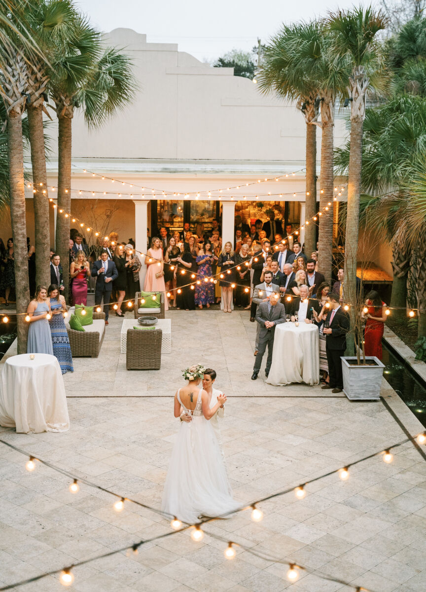 Restaurant Weddings: Two brides slow-dancing on the outdoor courtyard of Cannon Green.