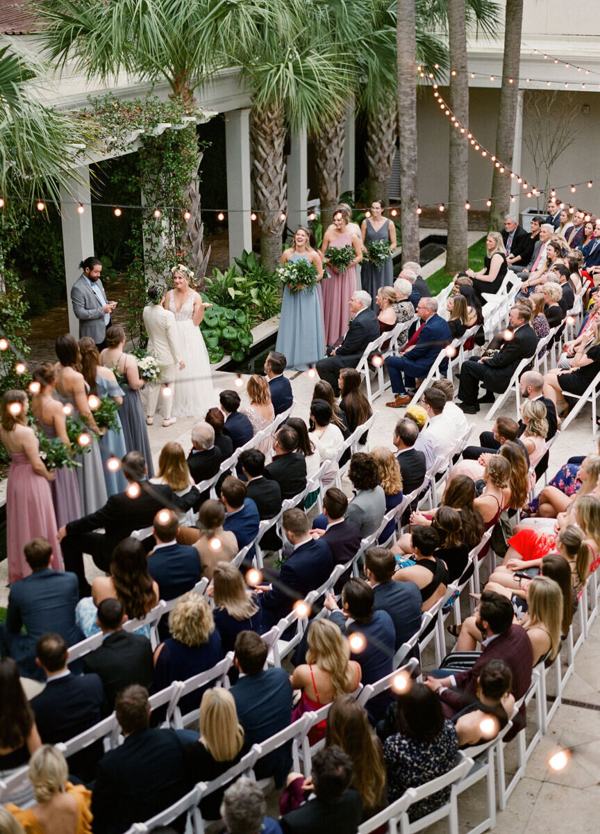 Restaurant Weddings: A birds-eye view of a crowd watching a wedding ceremony outdoors at Cannon Green.