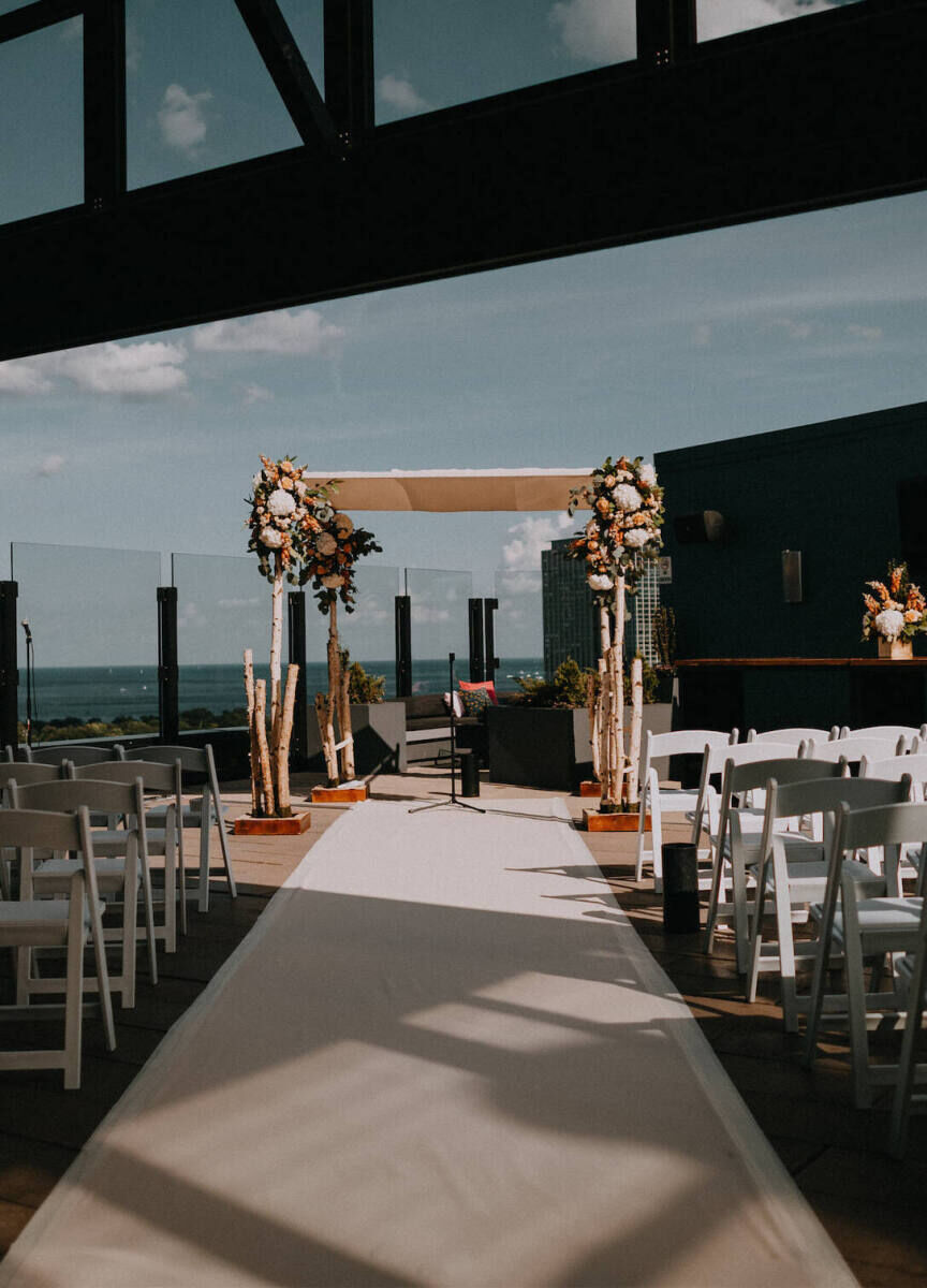 Restaurant Weddings: Outdoor, modern ceremony set-up on the roof of The J. Parker.