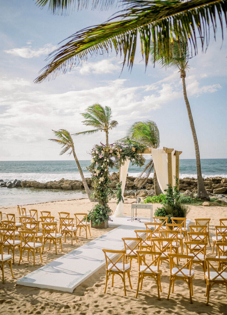 Romantic Wedding Venues: A beach wedding ceremony setup at Dorado Beach, A Ritz-Carlton Reserve.