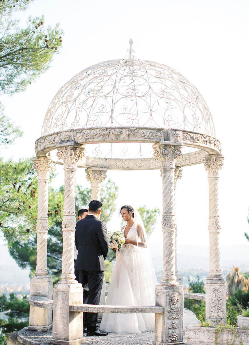 Romantic Wedding Venues: A bride and groom getting married under a beautiful outdoor awning at Château Saint Georges.