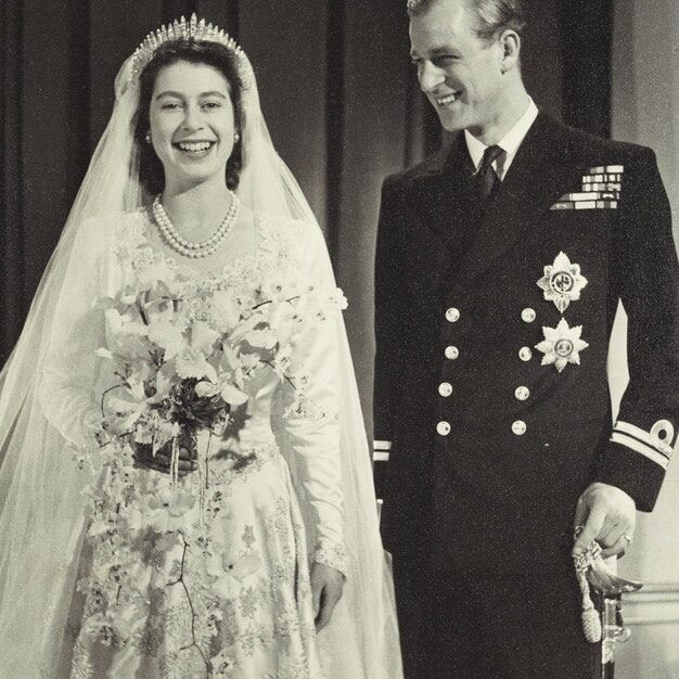 Royal Wedding Dresses: Queen Elizabeth and Prince Philip smiling on their wedding day.