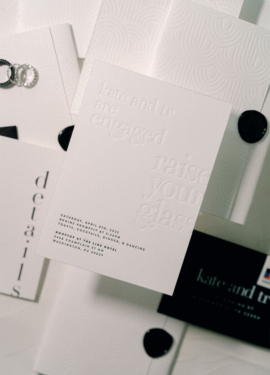 A black-and-white letterpress invitation asked guests to join the couple for an engagement party, but it turned out to be a surprise wedding, which incorporated the stark color combination with an explosion of bold hues.