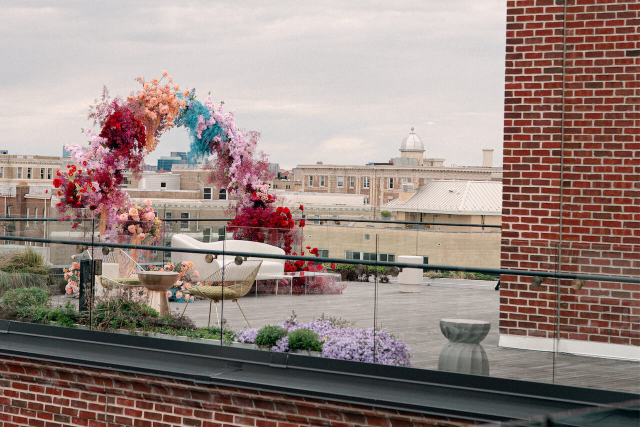 The rooftop of a DC hotel was set up for an engagement party, but then shifted to be the ceremony spot for the couple's surprise wedding.