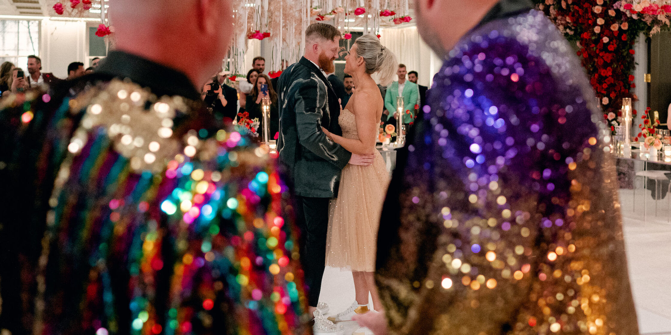 A pair of newlyweds share their first dance following their surprise wedding.