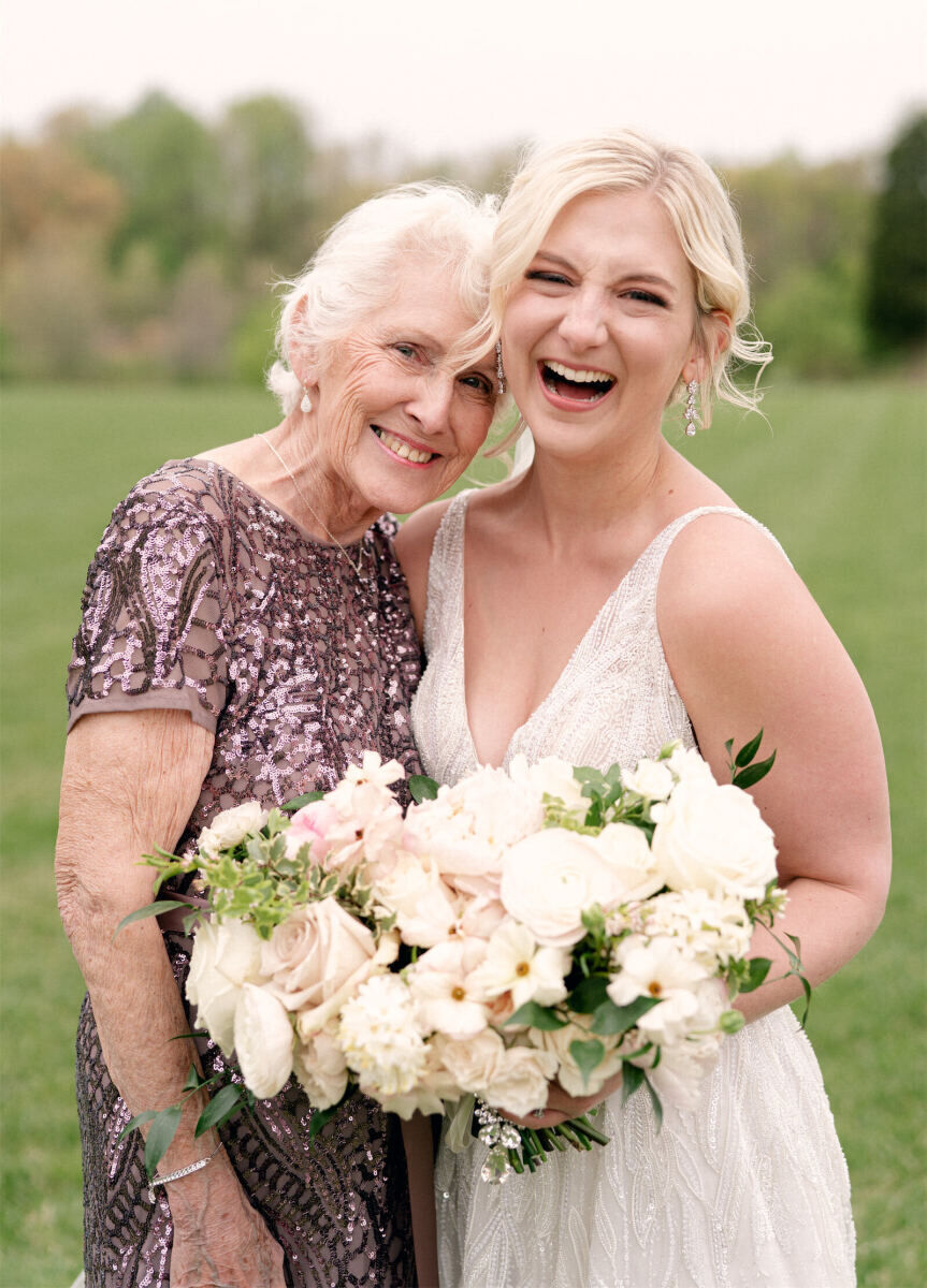 Tented Wedding: A bride and her grandmother smile in a wedding portrait.