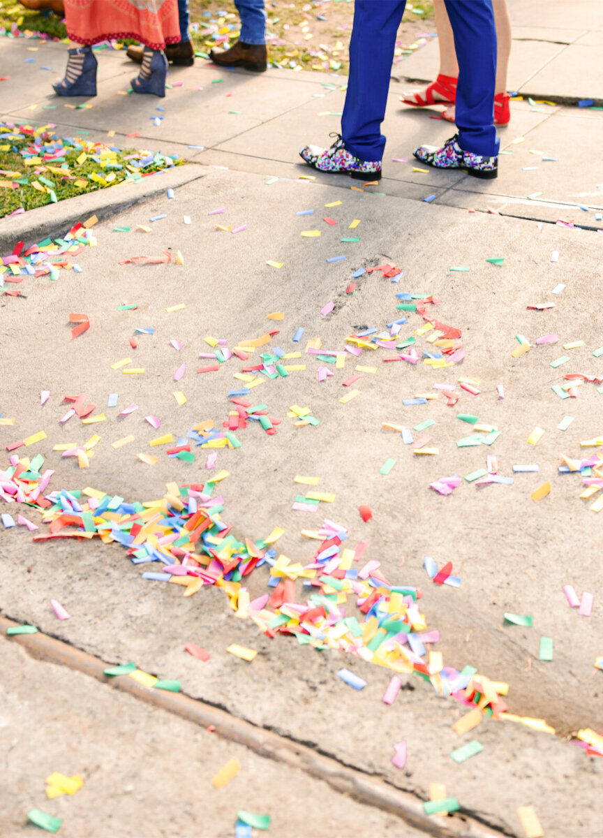 Biodegradable confetti was thrown following a vibrant, outdoor wedding ceremony.