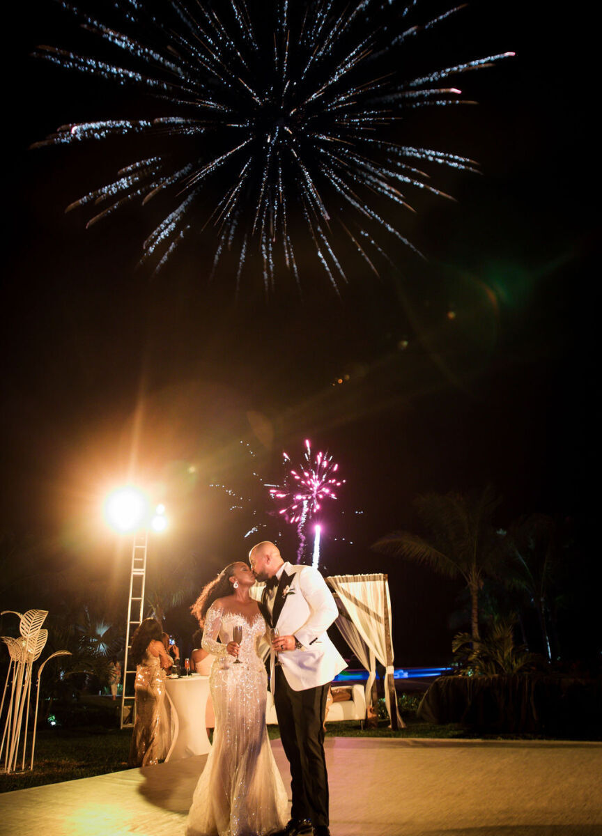 Wedding Fireworks Wedding Sparklers: A wedding couple kissing with two large fireworks behind them.