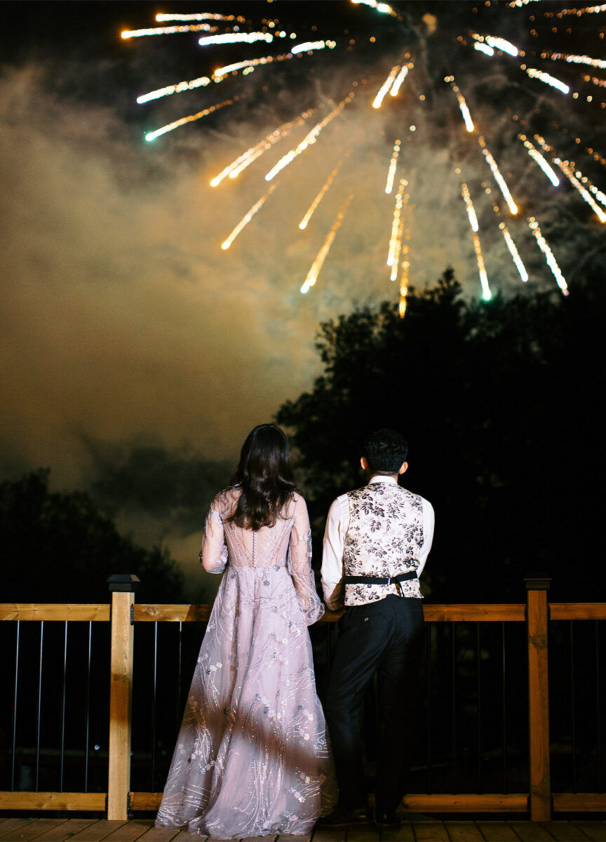 Wedding Fireworks Wedding Sparklers: A wedding couple looking out over a bridge to see fireworks. 