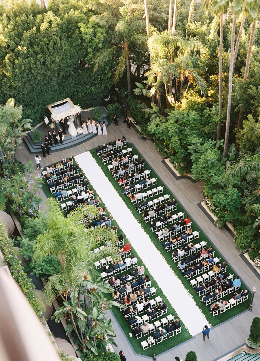 Wedding Photography Ideas: A bird's-eye view of an outdoor ceremony with a long white aisle.