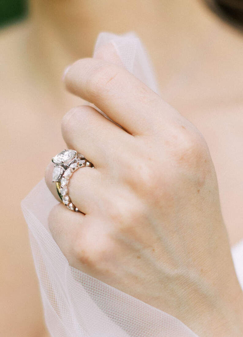 Wedding Ring Design: A bride wearing a two-stone engagement ring.