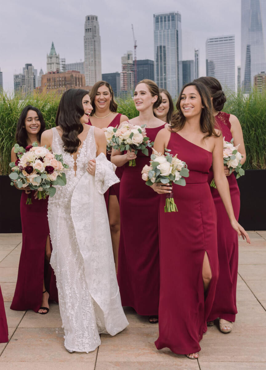 Wedding Tips: A bride smiling and walking with her wedding party.
