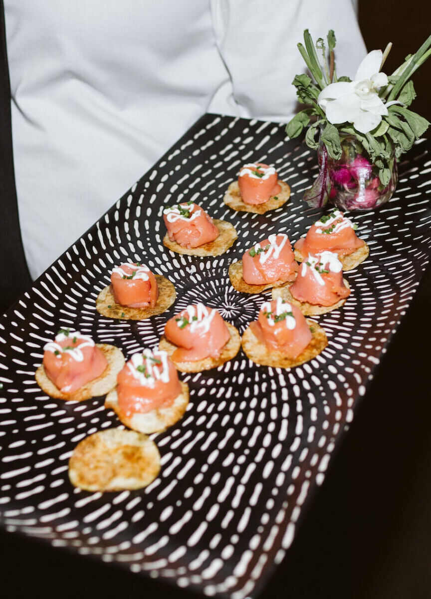 Wedding Tips: A server holding out a tray of hors d’oeuvres.