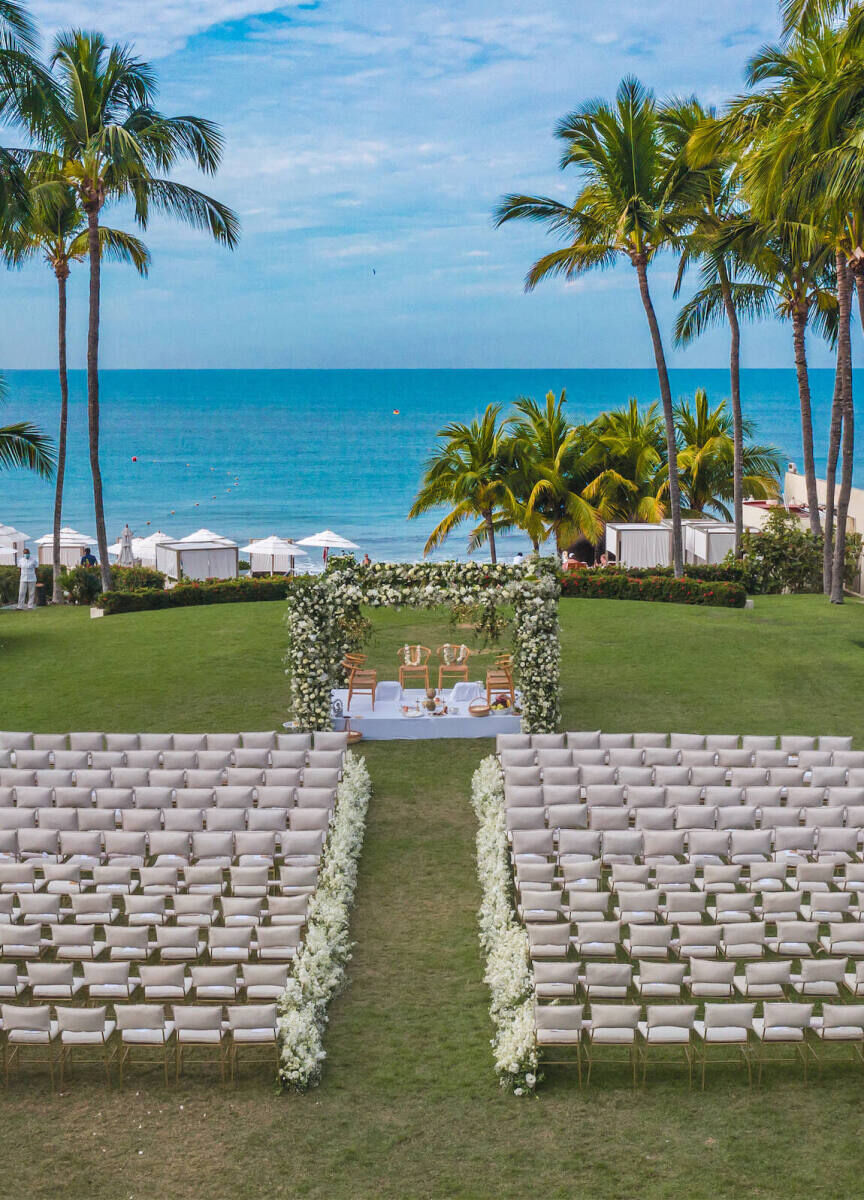 Wedding Tips: A waterfront wedding ceremony set up in Nuevo Vallarta, Nay., Mexico with tons of chairs and palm trees.