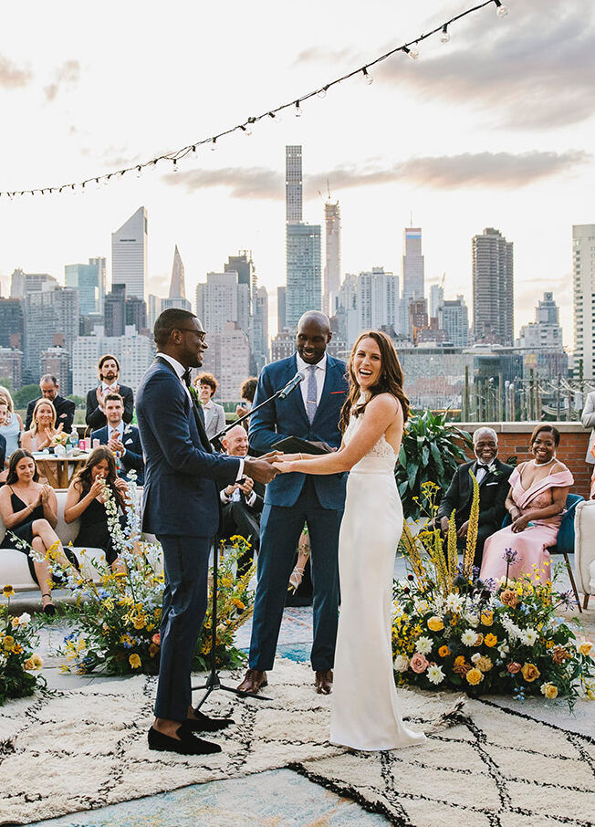 Best Wedding Venues for Creative Couples: A bride and groom getting married on the roof of The Bordone LIC.