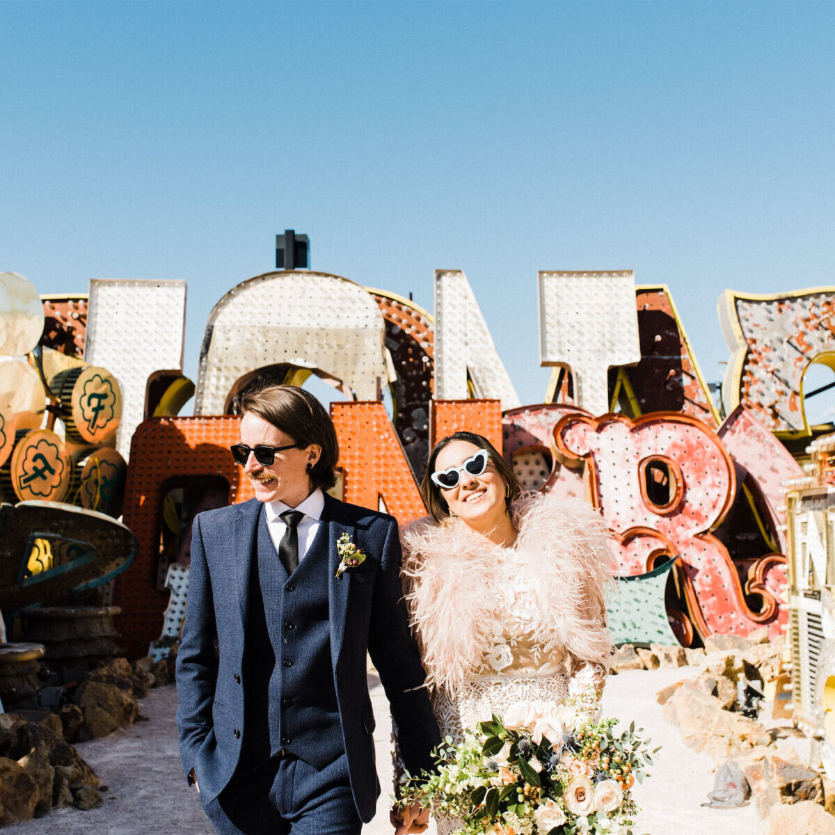 A bride and groom at The Neon Museum in Las Vegas.