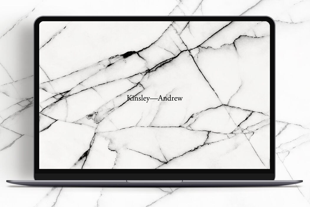 Wedding Website Examples: A desktop image of a marble-patterned wedding website homepage.
