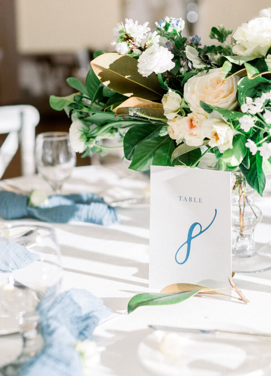 Wedding Website Examples: A reception table with the number 