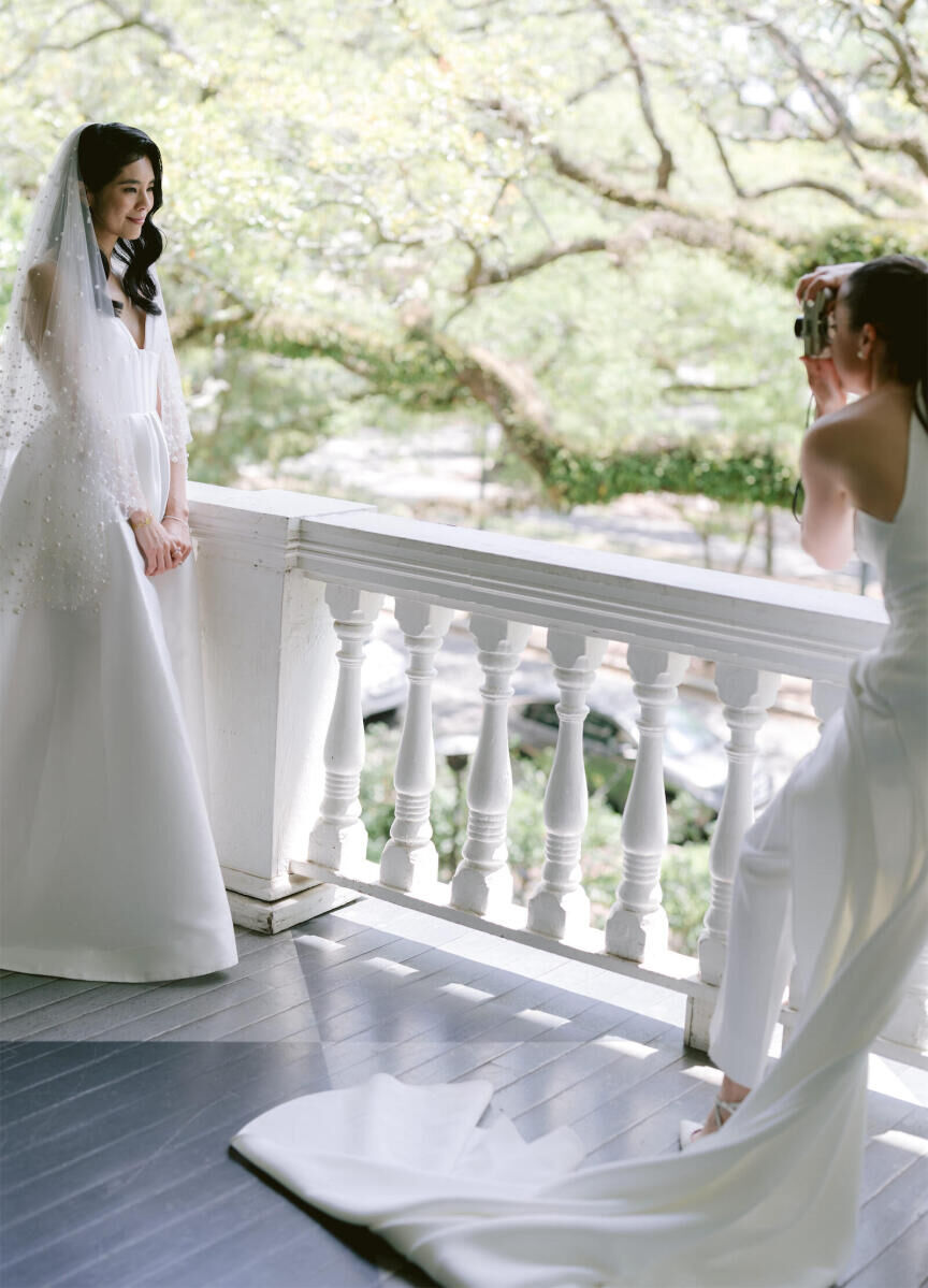 Both professional photographers, the brides couldn't resist picking up a camera at their whimsical wedding in Louisiana.