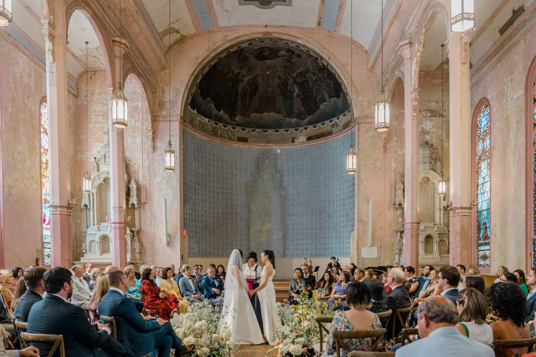 A ceremony in the round was anchored by pastel flowers at a whimsical wedding in New Orleans.